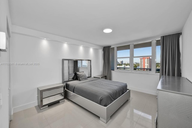 3140 S Ocean Dr Unit 1011, Hallandale Beach, FL 33009 - bedroom with light tile patterned flooring, baseboards, and recessed lighting