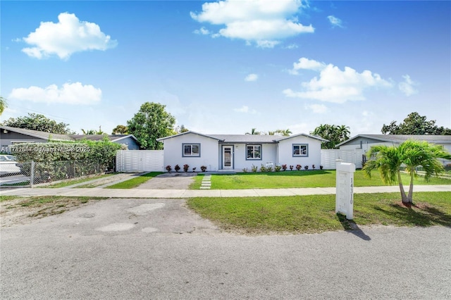 14310 SW 289th St, Homestead, FL 33033 - single story home featuring driveway, a front yard, and fence