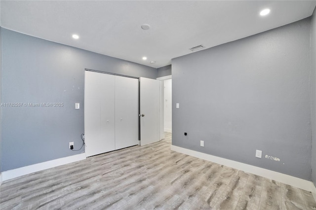14310 SW 289th St, Homestead, FL 33033 - unfurnished bedroom featuring baseboards, wood finished floors, visible vents, and a closet