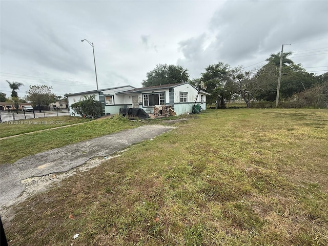 18300 NW 10th Ct, Miami Gardens, FL 33169 - exterior space with a front yard and fence