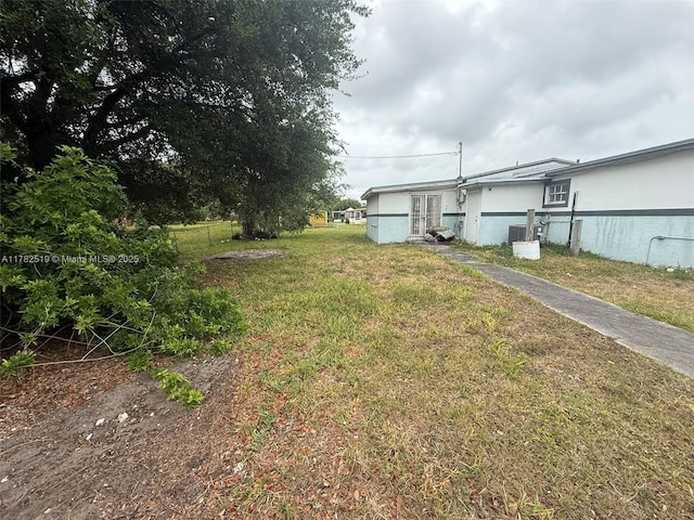 18300 NW 10th Ct, Miami Gardens, FL 33169 - view of yard featuring fence and central air condition unit