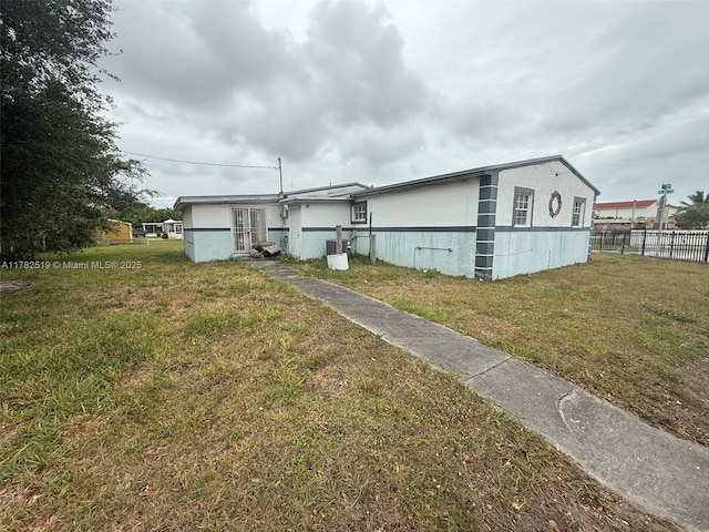 18300 NW 10th Ct, Miami Gardens, FL 33169 - back of property with fence and a lawn