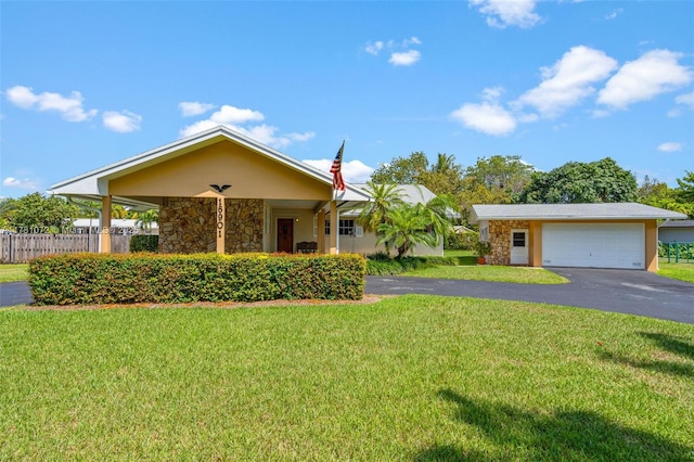 16901 SW 89th Ave, Palmetto Bay, FL 33157 - ranch-style home with a garage, stucco siding, stone siding, a front lawn, and driveway