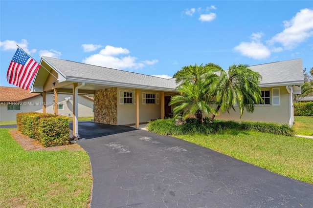 16901 SW 89th Ave, Palmetto Bay, FL 33157 - ranch-style house featuring stucco siding, an attached carport, and a front yard