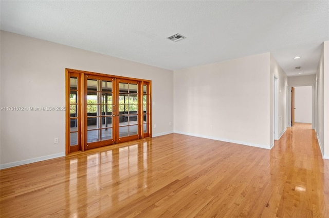 16901 SW 89th Ave, Palmetto Bay, FL 33157 - unfurnished room featuring light wood-style floors, french doors, baseboards, and visible vents