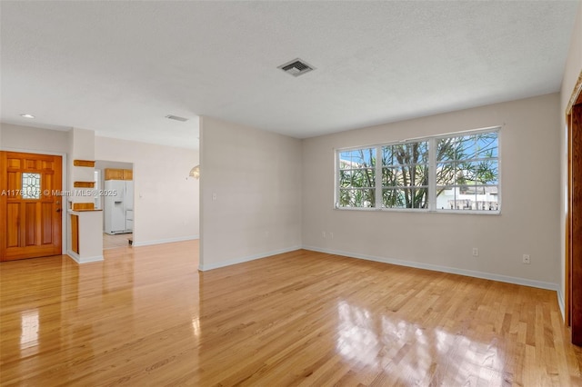 16901 SW 89th Ave, Palmetto Bay, FL 33157 - empty room with visible vents, baseboards, and light wood-type flooring