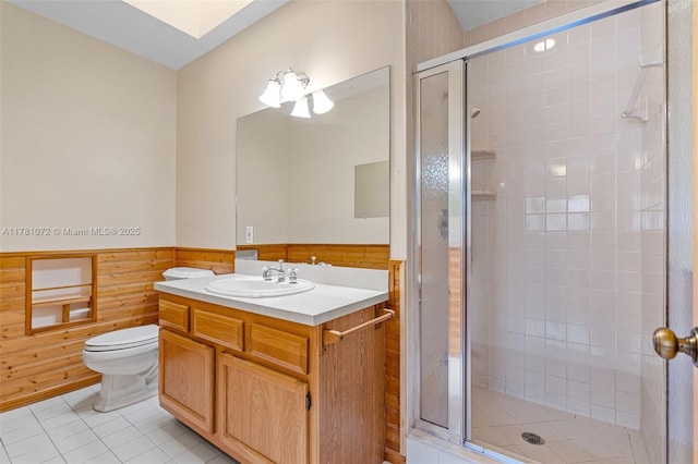 16901 SW 89th Ave, Palmetto Bay, FL 33157 - bathroom with tile patterned flooring, toilet, wainscoting, a stall shower, and wooden walls