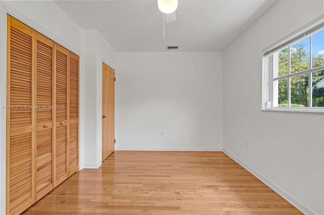 16901 SW 89th Ave, Palmetto Bay, FL 33157 - unfurnished bedroom with a closet, light wood finished floors, baseboards, and visible vents