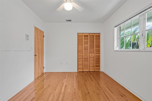 16901 SW 89th Ave, Palmetto Bay, FL 33157 - unfurnished bedroom featuring ceiling fan, light wood-style flooring, a closet, visible vents, and baseboards