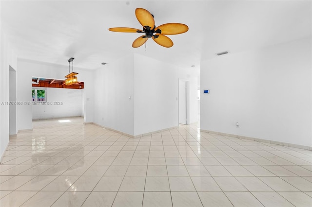 unfurnished room featuring a ceiling fan, visible vents, and light tile patterned floors