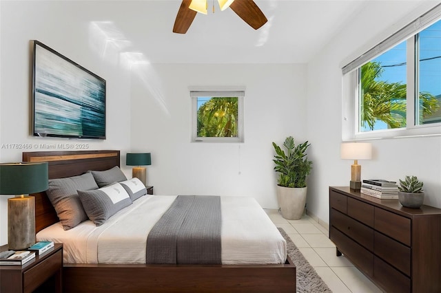 bedroom featuring ceiling fan and light tile patterned flooring