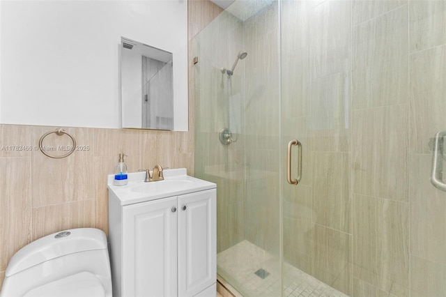 full bath with a shower stall, toilet, and vanity