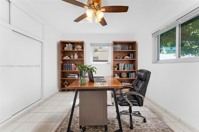 office area with ceiling fan and light tile patterned floors