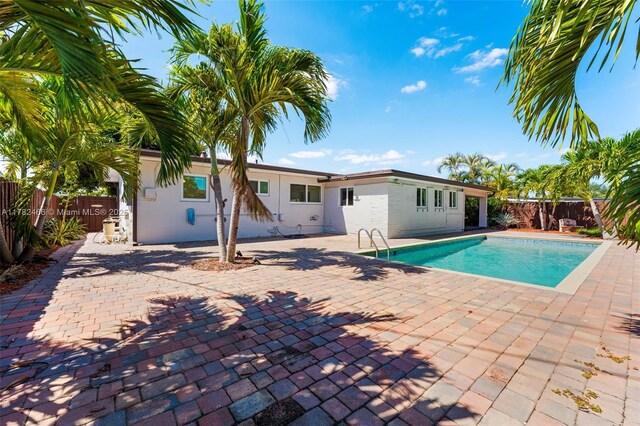 view of pool featuring a fenced backyard, a patio area, and a fenced in pool