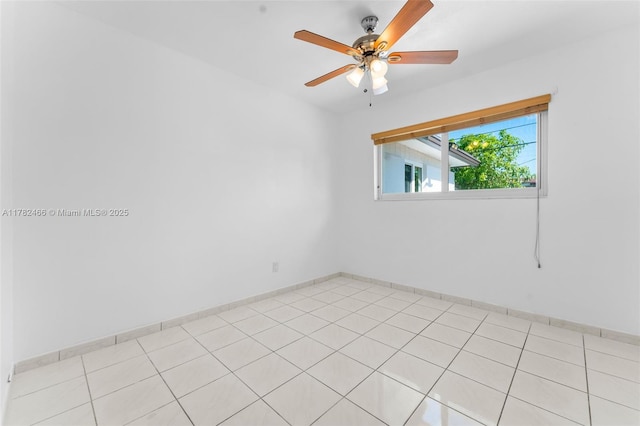 unfurnished room with baseboards and ceiling fan
