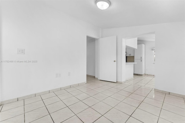 empty room featuring light tile patterned floors