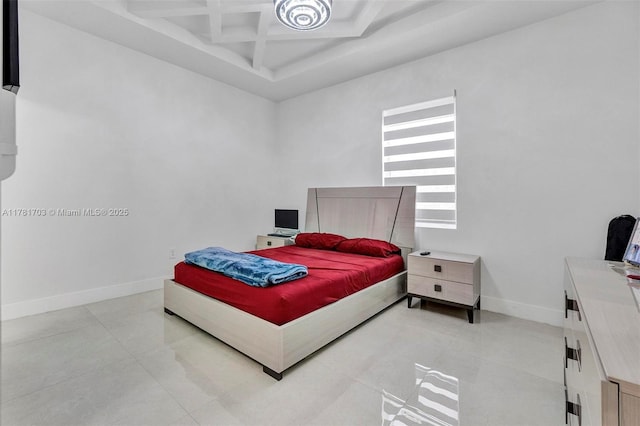 bedroom featuring coffered ceiling, light tile patterned floors, baseboards, and beam ceiling
