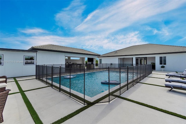 view of pool featuring a fenced in pool, a patio, and fence