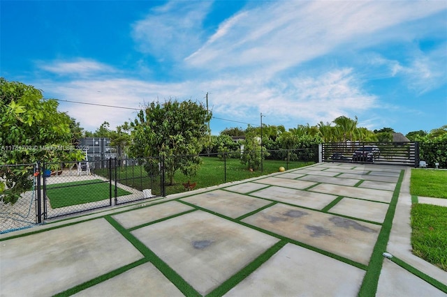 exterior space featuring fence and a gate