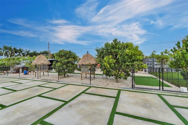 view of property's community with a gazebo, fence, and a gate
