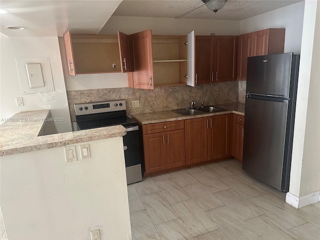 3161 Coral Ridge Dr, Coral Springs, FL 33065 - kitchen featuring open shelves, a sink, light countertops, brown cabinets, and stainless steel appliances