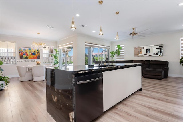 kitchen featuring open floor plan, visible vents, ornamental molding, and light wood-style flooring