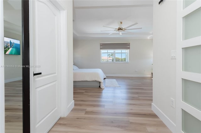 bedroom featuring baseboards and light wood-type flooring