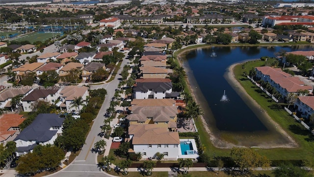 bird's eye view featuring a residential view and a water view