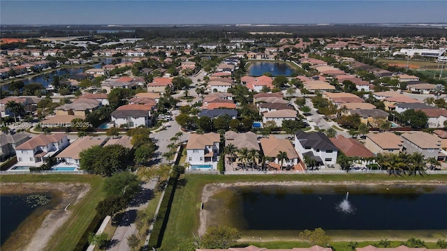 bird's eye view featuring a residential view and a water view