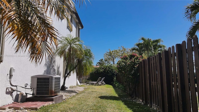 view of yard featuring cooling unit and a fenced backyard