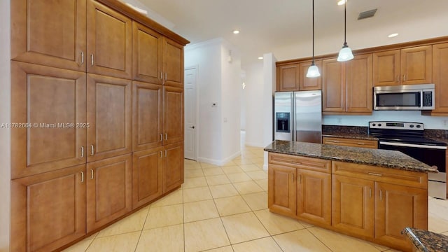 4713 Village Way, Davie, FL 33314 - kitchen featuring stainless steel appliances, a kitchen island, brown cabinets, light tile patterned floors, and recessed lighting