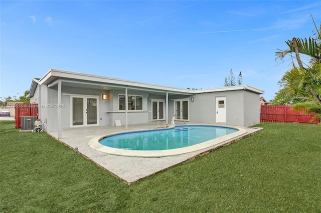 7320 Biltmore Blvd, Miramar, FL 33023 - back of property featuring french doors, stucco siding, central AC, and a patio