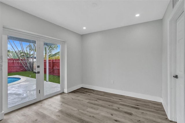 7320 Biltmore Blvd, Miramar, FL 33023 - doorway to outside with wood finished floors, baseboards, and recessed lighting