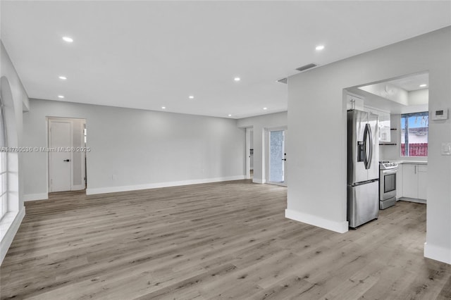 7320 Biltmore Blvd, Miramar, FL 33023 - unfurnished living room featuring light wood finished floors, recessed lighting, and baseboards