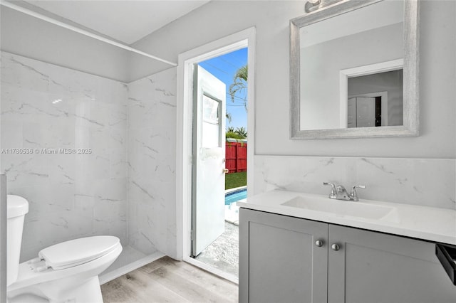 7320 Biltmore Blvd, Miramar, FL 33023 - bathroom featuring toilet, vanity, and wood finished floors