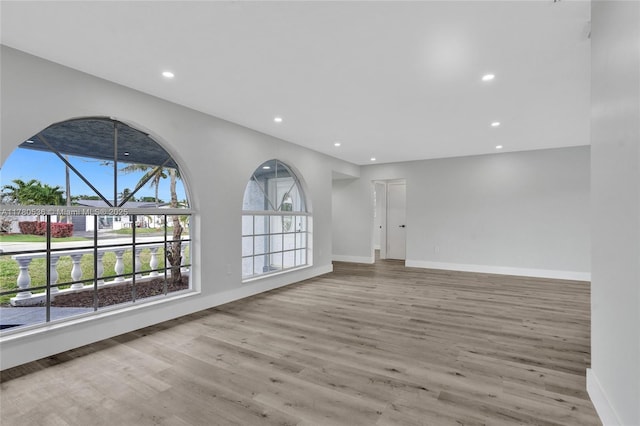 7320 Biltmore Blvd, Miramar, FL 33023 - unfurnished living room with wood finished floors, baseboards, and recessed lighting