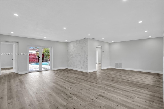 7320 Biltmore Blvd, Miramar, FL 33023 - unfurnished living room featuring recessed lighting, wood finished floors, baseboards, and french doors