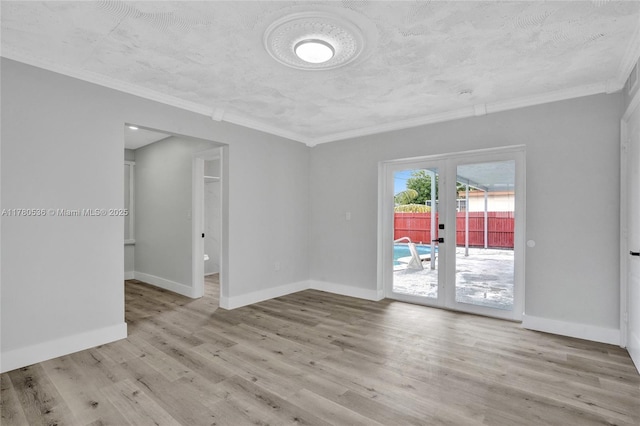 7320 Biltmore Blvd, Miramar, FL 33023 - unfurnished room featuring french doors, wood finished floors, baseboards, and ornamental molding