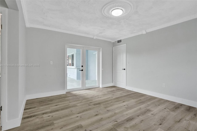 7320 Biltmore Blvd, Miramar, FL 33023 - empty room with wood finished floors, ornamental molding, baseboards, and french doors