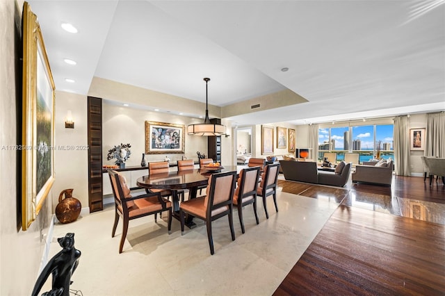 dining area featuring baseboards, visible vents, and recessed lighting