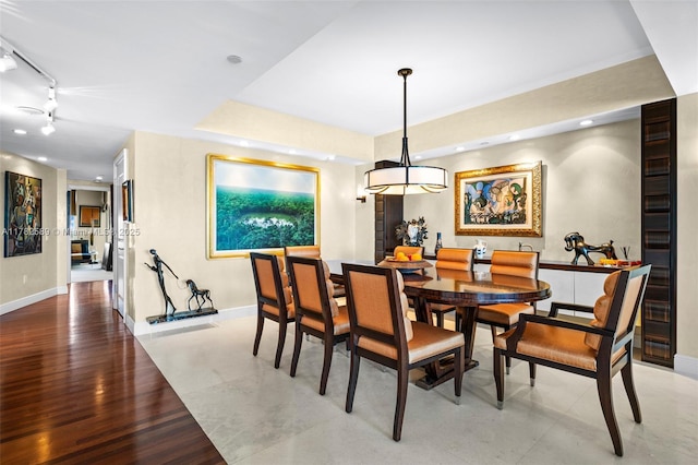dining room featuring baseboards