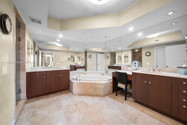 full bath featuring a bath, a stall shower, a sink, and visible vents