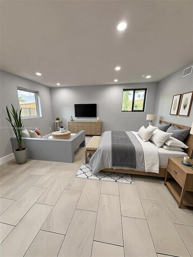 bedroom featuring recessed lighting, visible vents, and multiple windows