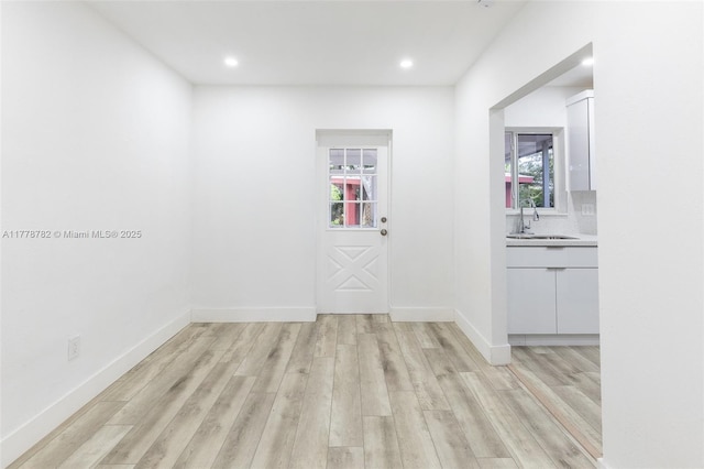6440 SW 20th St, Miramar, FL 33023 - unfurnished room featuring a sink, light wood-type flooring, recessed lighting, and baseboards