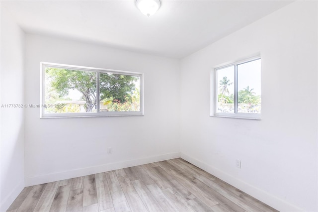 6440 SW 20th St, Miramar, FL 33023 - empty room featuring plenty of natural light, light wood-style flooring, and baseboards