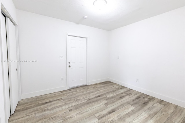 6440 SW 20th St, Miramar, FL 33023 - empty room featuring light wood-style flooring, baseboards, and a smoke detector