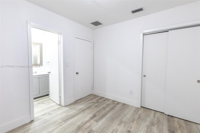 6440 SW 20th St, Miramar, FL 33023 - unfurnished bedroom with light wood-style flooring, a closet, and baseboards