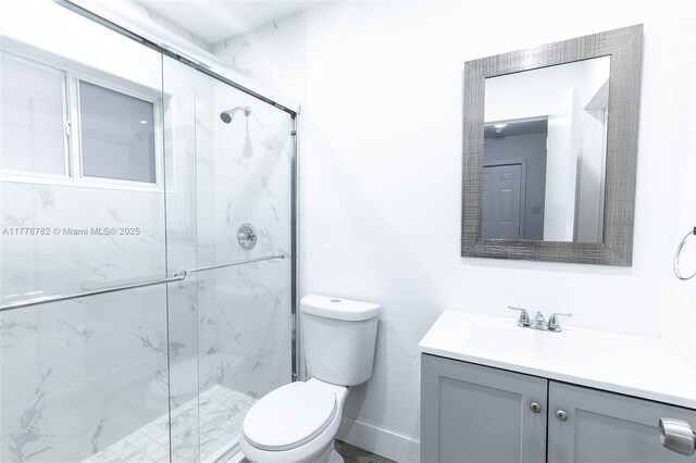 6440 SW 20th St, Miramar, FL 33023 - full bathroom featuring toilet, vanity, and a marble finish shower