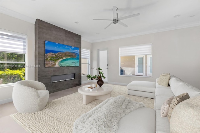 10972 Pine Lodge Trl, Davie, FL 33328 - living area with a fireplace, baseboards, a ceiling fan, and ornamental molding