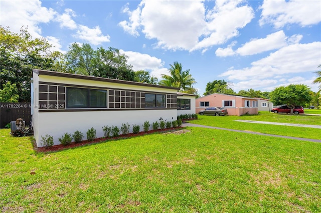 1000 NW 198th St, Miami Gardens, FL 33169 - ranch-style house featuring stucco siding and a front lawn